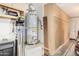 Utility room has a water heater, cabinets for storage, and other equipment at 13146 S 178Th Ave, Goodyear, AZ 85338