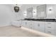 Elegant bathroom featuring a standalone tub, dual vanity, and modern chandelier at 1602 E Cloud Rd, Phoenix, AZ 85086