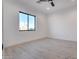 Bright bedroom with a modern ceiling fan and large window offering plenty of natural light at 1602 E Cloud Rd, Phoenix, AZ 85086