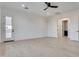 An open bedroom with hardwood floors, a ceiling fan, and access to the outside of the home at 1602 E Cloud Rd, Phoenix, AZ 85086