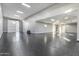 Large garage features epoxy flooring, bright lighting, and a modern, automated door at 1602 E Cloud Rd, Phoenix, AZ 85086
