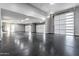 Spacious four car garage featuring epoxy flooring, overhead lighting, and automatic doors at 1602 E Cloud Rd, Phoenix, AZ 85086