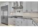Close-up of a modern kitchen featuring stainless steel appliances, gas range, and white subway tile backsplash at 1602 E Cloud Rd, Phoenix, AZ 85086