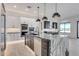 Spacious open-concept kitchen features an expansive island with striking countertops and modern pendant lighting at 1602 E Cloud Rd, Phoenix, AZ 85086