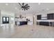 Spacious open-concept living area with modern floors, stainless steel appliances, and wine bar at 1602 E Cloud Rd, Phoenix, AZ 85086