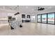 Open living area showcasing kitchen, wine bar, large windows, and view at 1602 E Cloud Rd, Phoenix, AZ 85086
