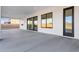 Covered patio with concrete floor and mountain views through sliding glass doors at 1602 E Cloud Rd, Phoenix, AZ 85086
