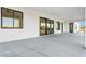 An expansive patio area perfect for outdoor entertaining, accessible via modern sliding doors at 1602 E Cloud Rd, Phoenix, AZ 85086