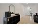 Clean hallway with a decorative mirror and a clear view to the home's entry at 17286 W Running Deer Trl, Surprise, AZ 85387