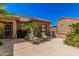 Backyard patio with seating offers a relaxing outdoor living space at 18014 N Calypso Ct, Surprise, AZ 85374