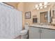 Bathroom features a shower/tub, vanity, and a mirror at 18014 N Calypso Ct, Surprise, AZ 85374