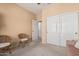 Neutral bedroom with ample closet space, woven chairs, and a bright, airy feel at 18014 N Calypso Ct, Surprise, AZ 85374