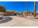 Well-maintained single-story home with tile roof, desert landscaping, and long driveway at 18014 N Calypso Ct, Surprise, AZ 85374