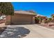 Lovely single-story home featuring a spacious two-car garage and easy care landscaping at 18014 N Calypso Ct, Surprise, AZ 85374
