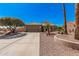 Charming single-story home with desert landscaping, tile roof, and inviting curb appeal at 18014 N Calypso Ct, Surprise, AZ 85374