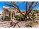 Charming home exterior featuring lush landscaping, mature trees, and a well-maintained yard at 18014 N Calypso Ct, Surprise, AZ 85374