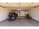 Bright, clean garage with a golf cart and plenty of storage, ideal for organization at 18014 N Calypso Ct, Surprise, AZ 85374