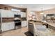 Beautiful kitchen featuring white cabinets, granite countertops, stainless steel appliances, and natural light at 18014 N Calypso Ct, Surprise, AZ 85374