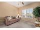 Cozy living room with comfortable seating, natural light from window, and stylish decor at 18014 N Calypso Ct, Surprise, AZ 85374