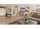 Inviting open floor plan with breakfast bar connecting the kitchen to the spacious living area at 18014 N Calypso Ct, Surprise, AZ 85374