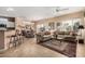 Open concept living room with tile flooring, natural light, and access to the backyard at 18014 N Calypso Ct, Surprise, AZ 85374