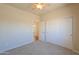 Well-lit bedroom featuring plush carpet, closet space, and neutral paint at 1825 E Sycamore Rd, Casa Grande, AZ 85122