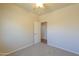 Neutral bedroom with soft carpet and direct access to the hallway at 1825 E Sycamore Rd, Casa Grande, AZ 85122