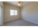 Bright, carpeted bedroom with natural light from a window at 1825 E Sycamore Rd, Casa Grande, AZ 85122