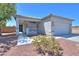 Well-maintained home featuring desert landscaping, a welcoming front porch, and a two-car garage at 1825 E Sycamore Rd, Casa Grande, AZ 85122