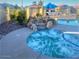 Inviting community hot tub with rock waterfall feature and lounge seating at 1825 E Sycamore Rd, Casa Grande, AZ 85122