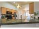 Bright kitchen featuring granite countertops, stainless steel appliances, and a mosaic backsplash at 1825 E Sycamore Rd, Casa Grande, AZ 85122