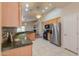 Spacious kitchen boasting stainless steel appliances, granite countertops, and tile flooring at 1825 E Sycamore Rd, Casa Grande, AZ 85122