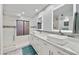 Modern primary bathroom features dual vessel sinks, and a walk-in shower with stylish tile at 18665 N 70Th Dr, Glendale, AZ 85308