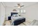 Cozy bedroom with neutral walls, wood-look floors, and a ceiling fan for added comfort at 18665 N 70Th Dr, Glendale, AZ 85308