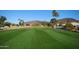 Expansive golf course view with rolling hills in the distance and blue sky overhead at 18665 N 70Th Dr, Glendale, AZ 85308