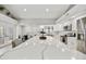 Bright open kitchen with a large center island, stainless appliances, and a modern design at 18665 N 70Th Dr, Glendale, AZ 85308