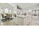 Bright, open-concept kitchen with modern appliances, large island and dining area at 18665 N 70Th Dr, Glendale, AZ 85308