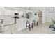 Bright kitchen featuring white cabinets, marble countertops, and stainless steel appliances at 18665 N 70Th Dr, Glendale, AZ 85308