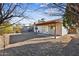 Large backyard featuring gravel landscaping, covered patio, and privacy fence at 20602 N 31St Dr, Phoenix, AZ 85027