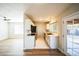 Open-concept layout with modern white cabinets and stainless steel appliances, seamlessly connecting to the living area at 20602 N 31St Dr, Phoenix, AZ 85027