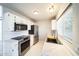 Updated kitchen with white cabinets, stainless steel appliances, modern countertops, and a stylish backsplash at 20602 N 31St Dr, Phoenix, AZ 85027
