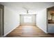 Bright and spacious living area with modern flooring, a ceiling fan, and convenient access to the kitchen at 20602 N 31St Dr, Phoenix, AZ 85027