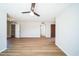 Spacious living area featuring modern floors, a ceiling fan, and access to an open closet space at 20602 N 31St Dr, Phoenix, AZ 85027