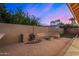 Backyard features a fire pit, seating, and desert landscaping at 21 W Pecan Pl, Tempe, AZ 85284