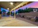 Covered patio features a built-in grill, seating, and a pool in the backyard at 21 W Pecan Pl, Tempe, AZ 85284