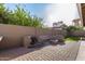 Outdoor entertaining area features a built-in water feature, fire pit, and custom seating perfect for gatherings at 21 W Pecan Pl, Tempe, AZ 85284