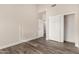 Neutral bedroom features wood-look floors and a closet with sliding doors at 21 W Pecan Pl, Tempe, AZ 85284