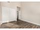 Bright bedroom features wood-look floors and a closet with sliding doors at 21 W Pecan Pl, Tempe, AZ 85284