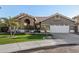 Inviting single-story home featuring a tile roof, desert landscaping, and a two-car garage at 21 W Pecan Pl, Tempe, AZ 85284