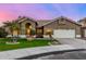 Inviting single-story home featuring a tile roof, desert landscaping, and a two-car garage at 21 W Pecan Pl, Tempe, AZ 85284